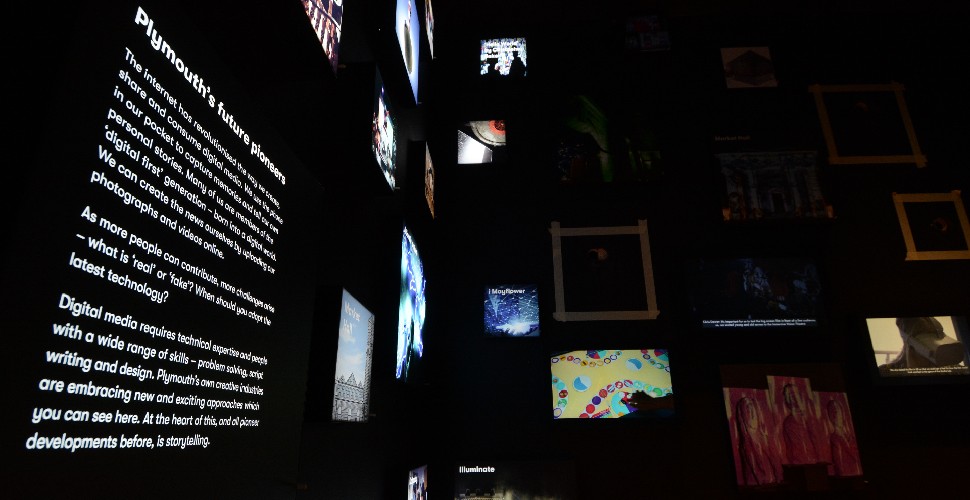 The media lab gallery at The Box with digital screens showing images and text